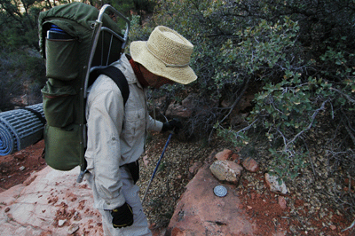 John checks out a U.S. Geological Survey benchmark on the North Bass