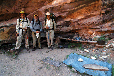 Chris, Dennis and John standing amidst the wealth of relics at the Bass Camp in Shinumo Creek