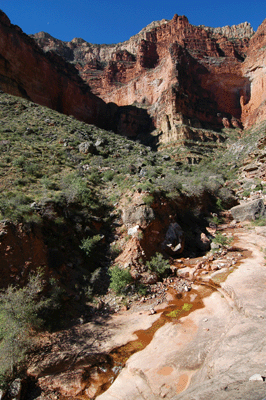 Water flows through Serpentine at the trail crossing