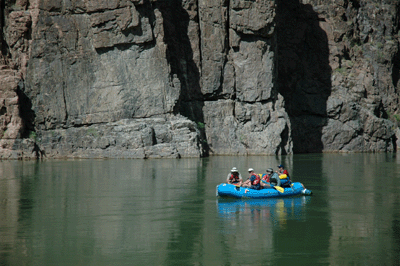 Rafters floating by Granite Rapids beach