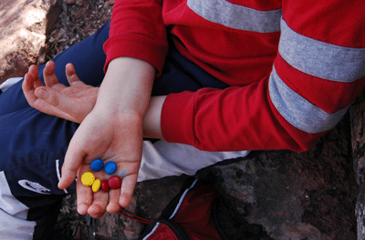 Matthew holding a 'smiley face' M&M cluster