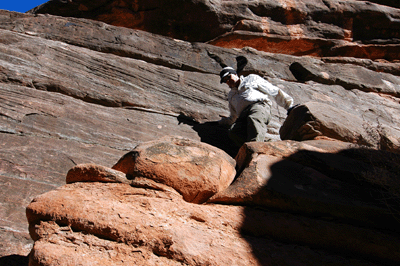 Dennis descending the steps toward the makeshift ladder