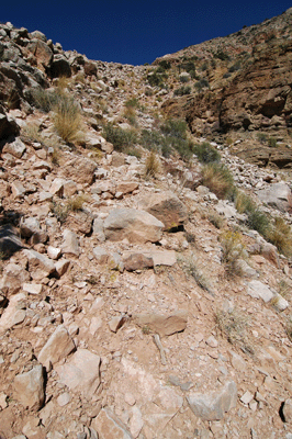 Hiking up through a boulder field on Nankoweap Trail