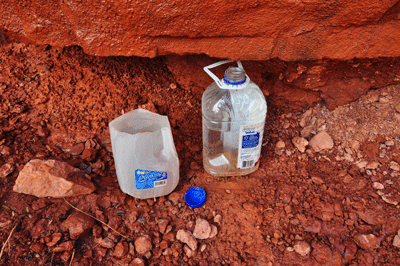 Containers left to capture water from a seep near Marion Point