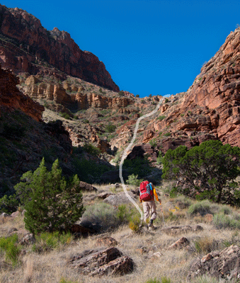 Chris leads the way up through a break in the Tapeats to bypass a dryfall in south Unkar