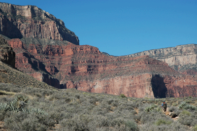 A lone hiker heads west along the Tonto Trail