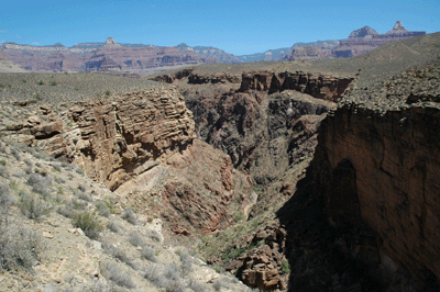 The view through Pipe Creek drainage with Sumner Butte, Zoroaster Temple, and Buddha Temple seen across the canyon