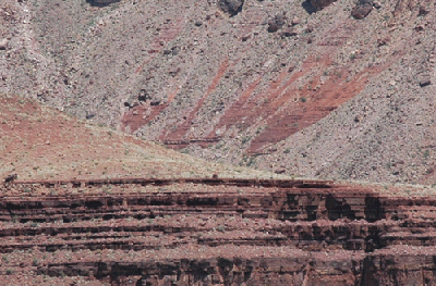 This cropped section of the photo to the left shows a large cairn (centered at the edge of the Tapeats) marking Hance's route to the asbestos mines