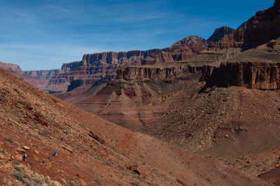 A pair of backpackers work their way down Tanner trail