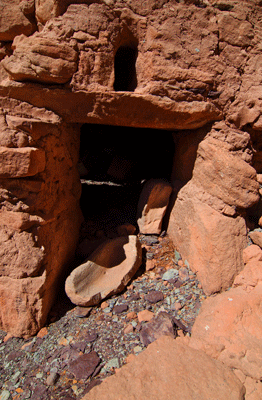 A metate stone marks the entrance to the main granary at Juno Ruin