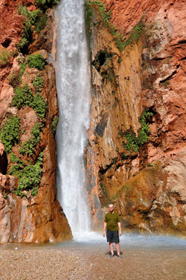 The author stands in the pool at the base of Deer Creek falls