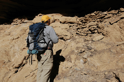 Inspecting the ruins in the descent drainage